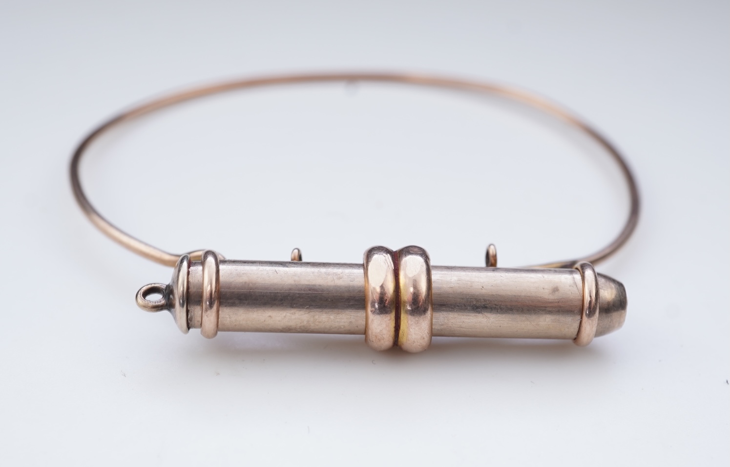 A gold bracelet and propelling pencil, first half 20th century